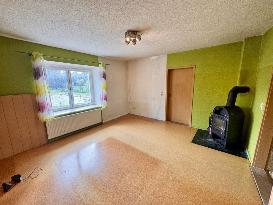 Zimmer mit Kaminofen Einfamilienhaus Knorrendorf / Kastorf