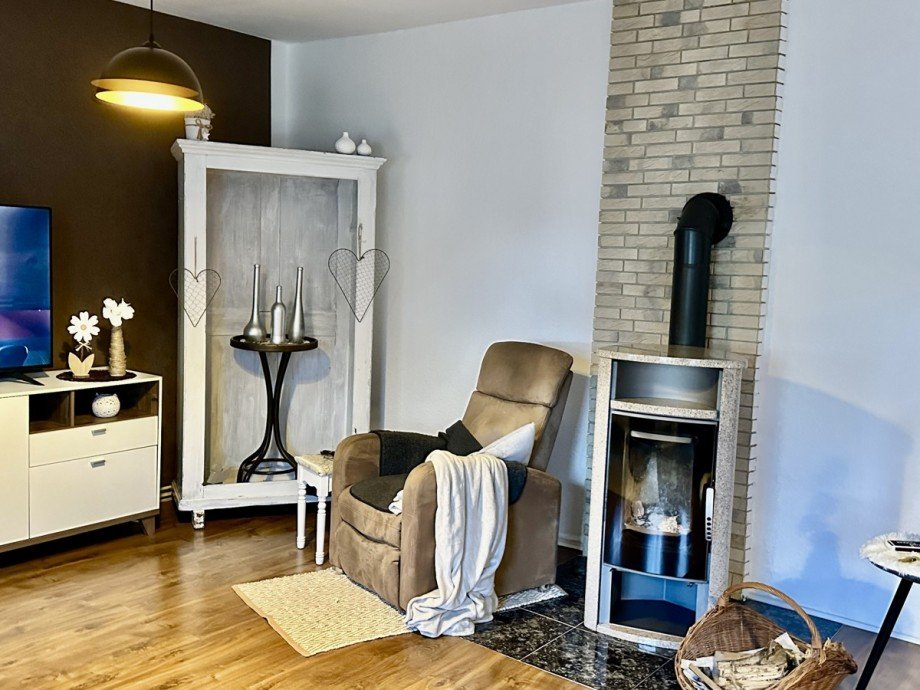 Wohnzimmer mit Kamin Doppelhaush�lfte Papendorf