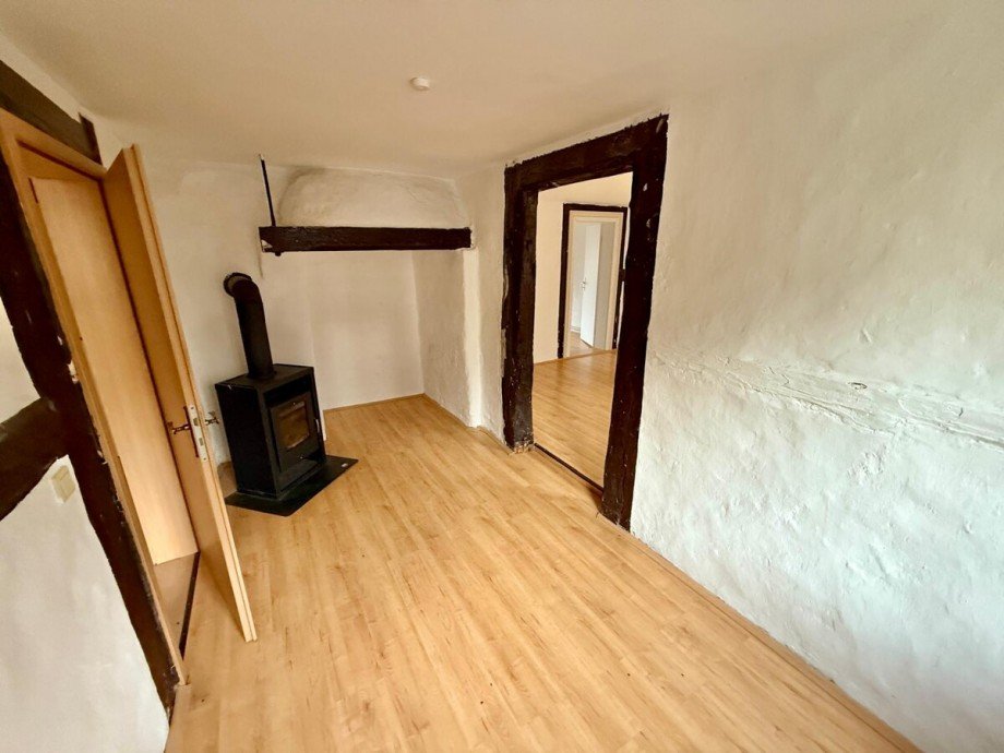 Zimmer OG 1 mit Kamin Einfamilienhaus Friedland