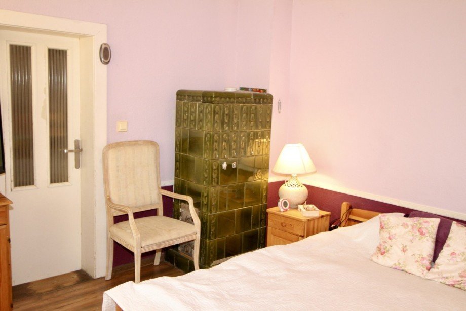 Kachelofen im Schlafzimmer Einfamilienhaus Mescherin / Radekow